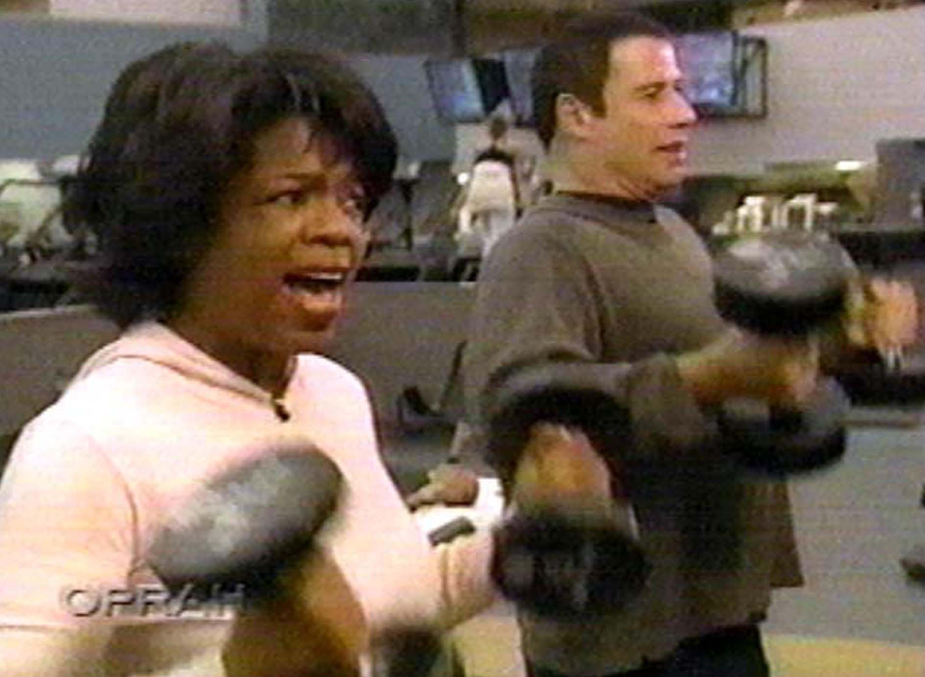 Oprah Winfrey with John Travolta in 1990