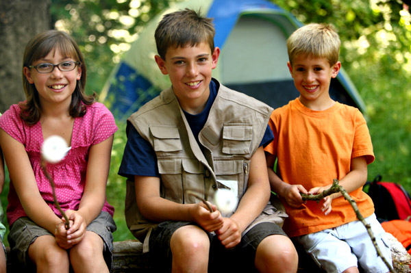 Camp kids roasting marshmallows