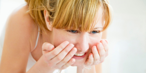 Woman in 20s washing face