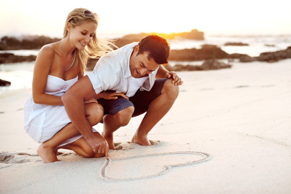 Newlywed couple on the beach for honeymoon