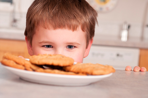 Boy looking at cookies