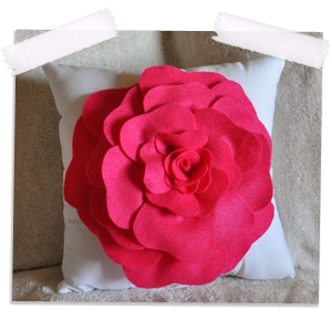 Hot pink rose on white pillow