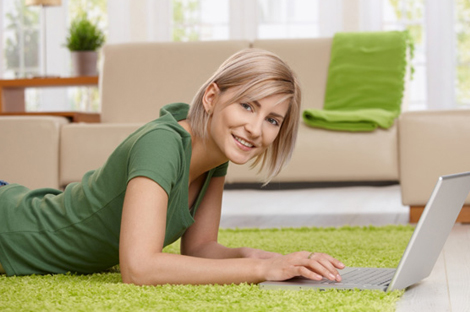 Woman spring cleaning computer