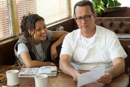 Gugu and Tom Hanks go over a scene on the set of Larry Crowne