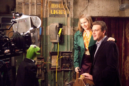 Kermit, Amy Adams and Jason Segel on the set of The Muppets