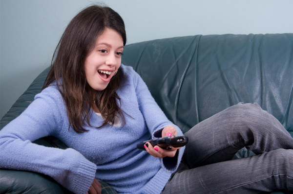 Teen girl watching tv