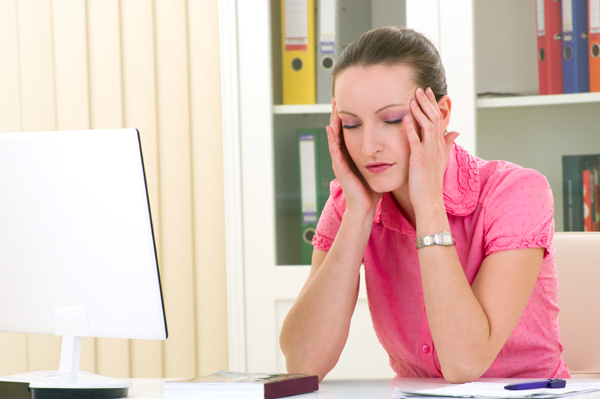 Woman falling asleep at desk
