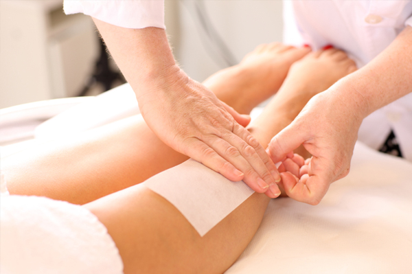 Woman getting waxed