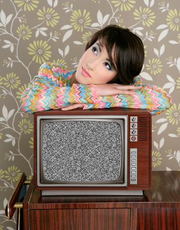 Woman with broken retro tv