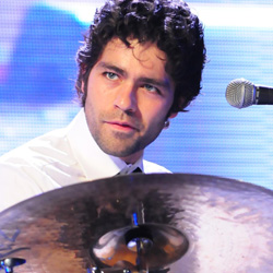 Adrian Grenier playing drums