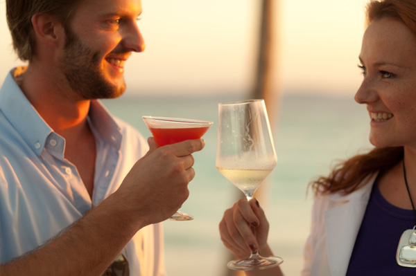 Couple having drinks on patio