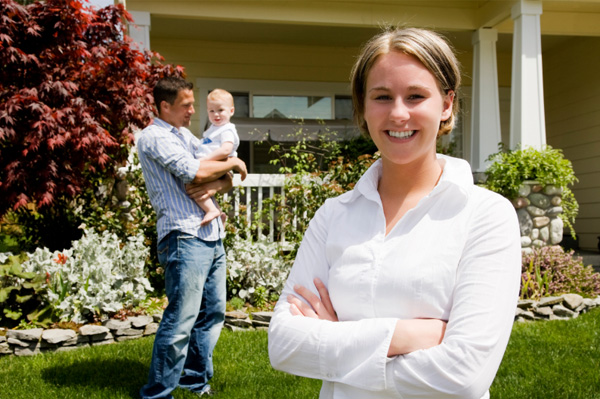 Family in front of new home
