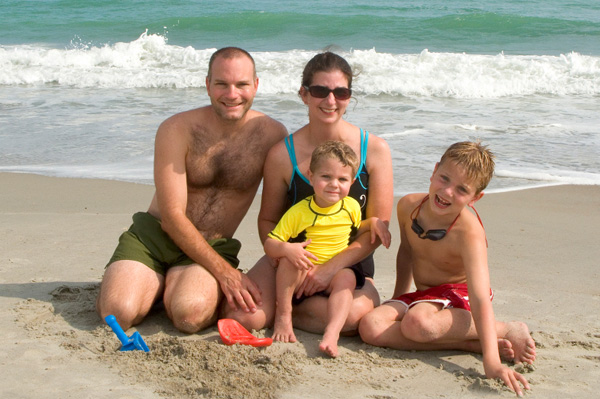 Family with toddler at beach