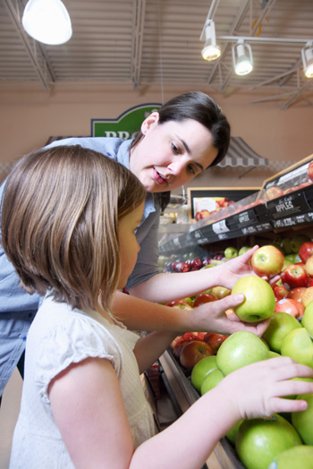 Mom and child grocery shopping