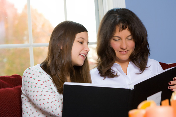 Mom and teen looking at photos