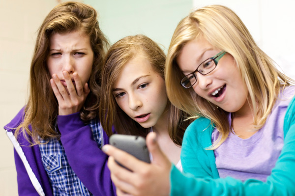 Tween girls on cell phones
