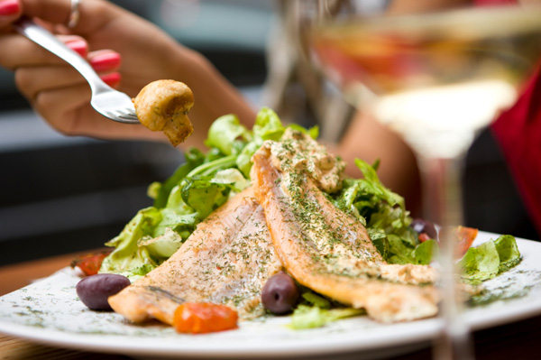 Woman eating salmon