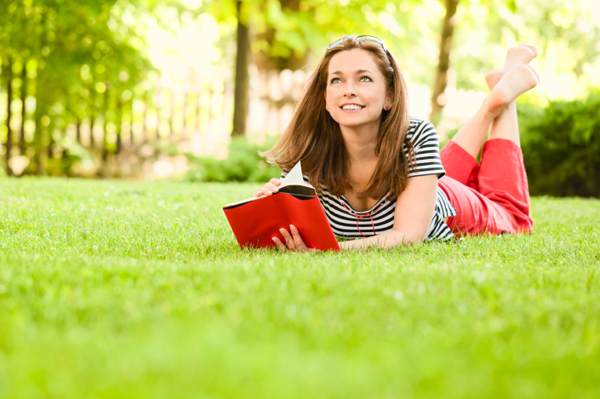Woman reading book outside