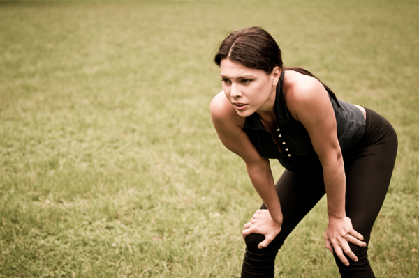 Woman with knee pain running