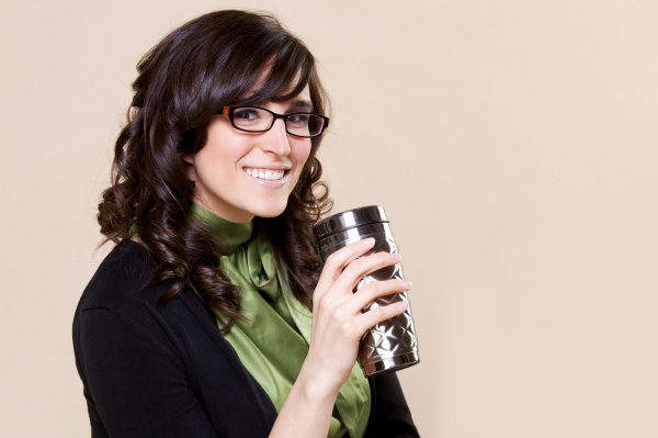 Woman with travel coffee mug