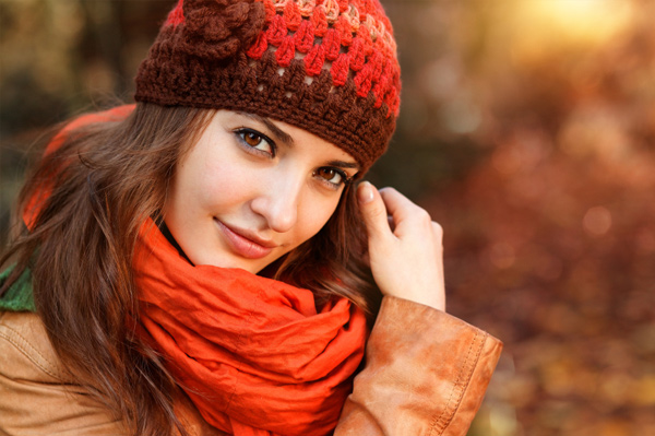 Brown haired woman wearing orange