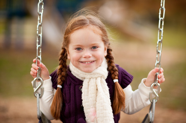Little girl on fall playground