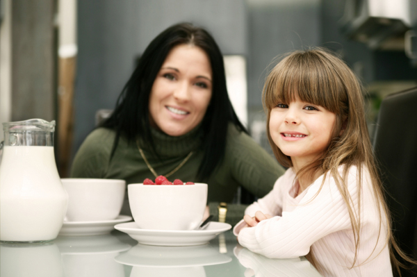 Mom and daughter eating cereal