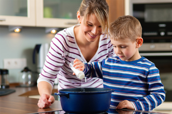 Mom cooking with son