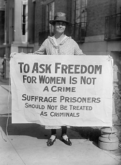 Woman holding suffrage sign