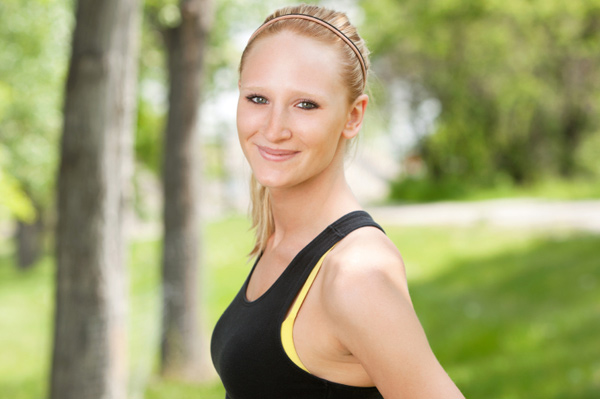 Woman wearing green fitness gear