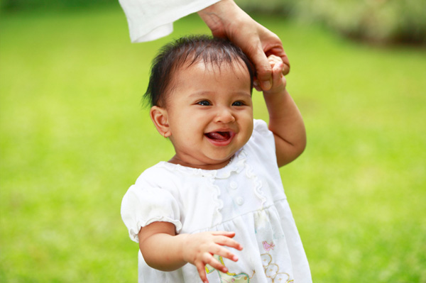 Baby taking first steps