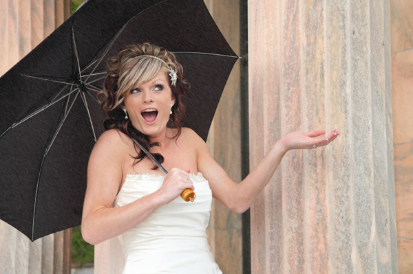Bride on wedding day in the rain