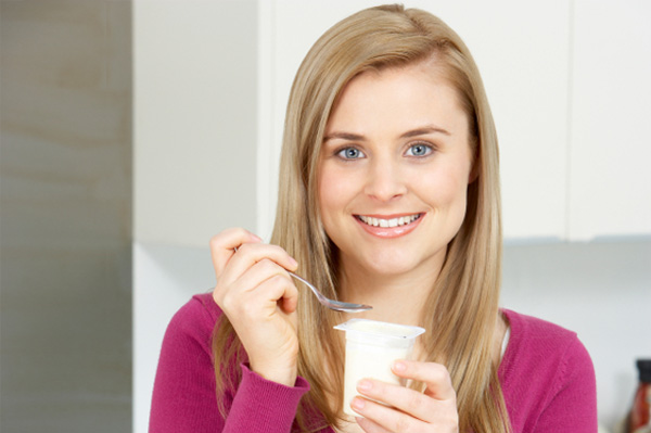 Woman eating yogurt