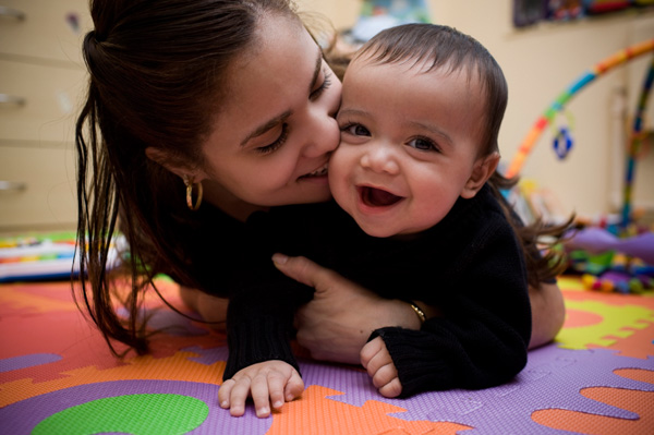 Mom and baby in babyproofed room