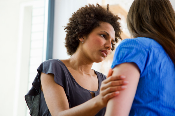Woman consoling friend