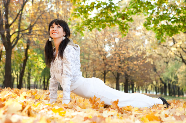 Woman doing stretches in the fall
