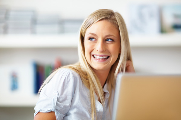 Young business woman on computer