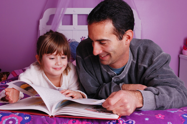 Dad reading with daughter