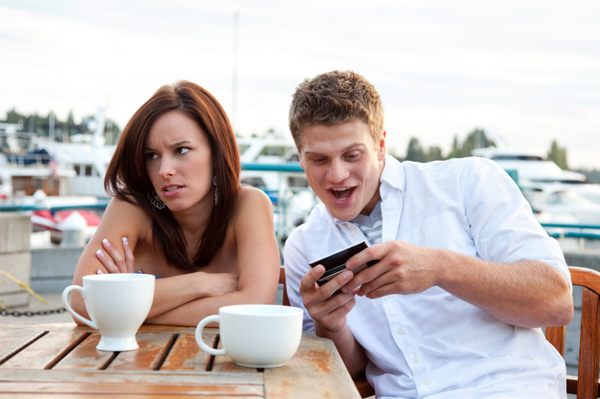 Man using groupon on a date