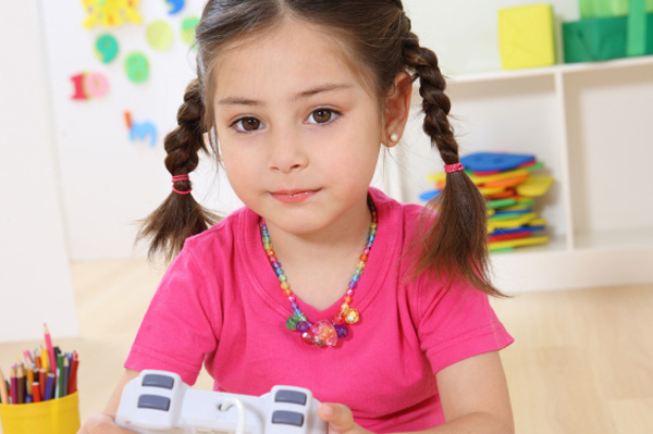 Preschooler playing video games