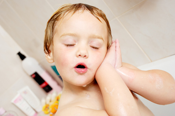 Preschooler taking relaxing bath