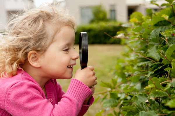 Preschooler with magnifine glass