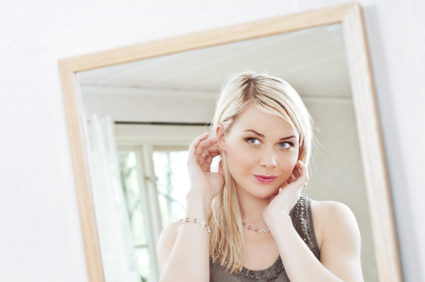 Woman looking in mirror