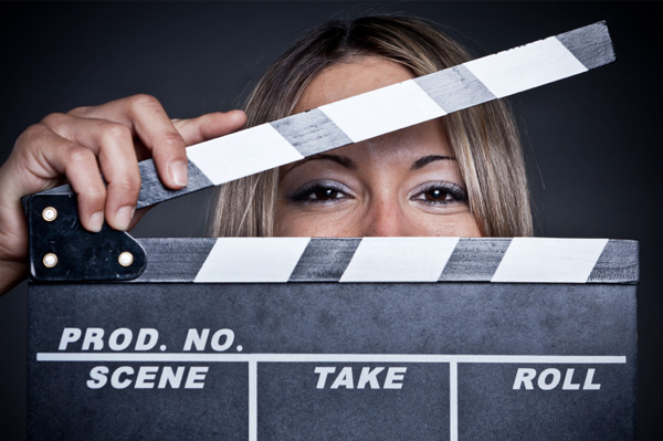 Woman with clapperboard