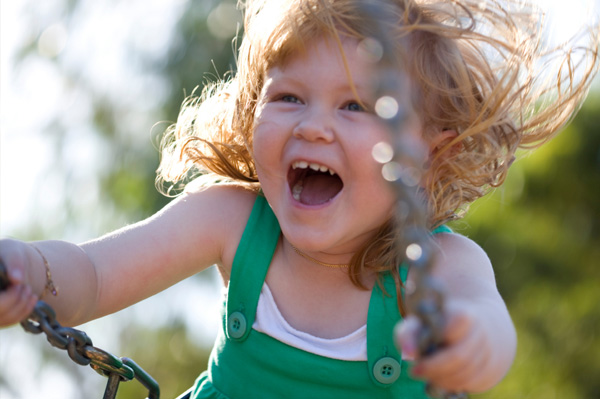 Action shot of girl on swing