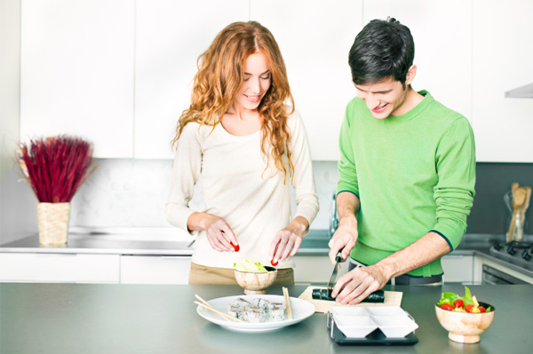 Couple making sushi at home