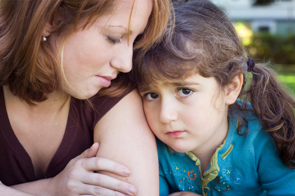 Mom consoling daughter