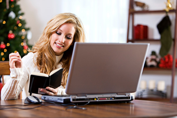 Woman shopping online for Christmas gifts