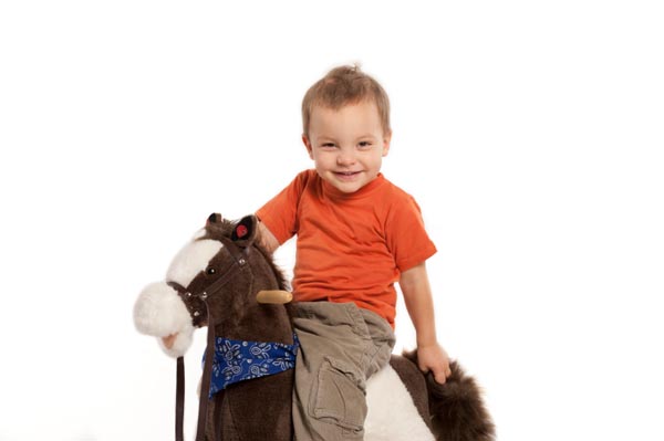 child on rocking horse with SPD