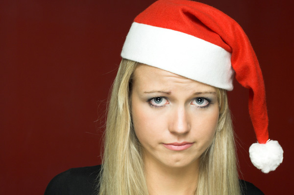 Woman sulking in santa hat